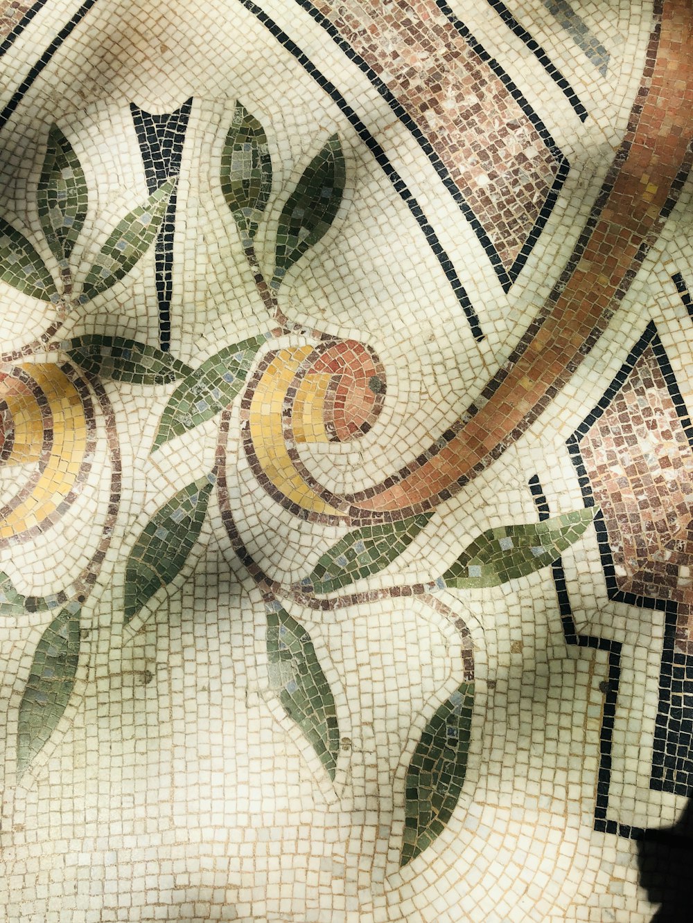 white brown and green floral textile