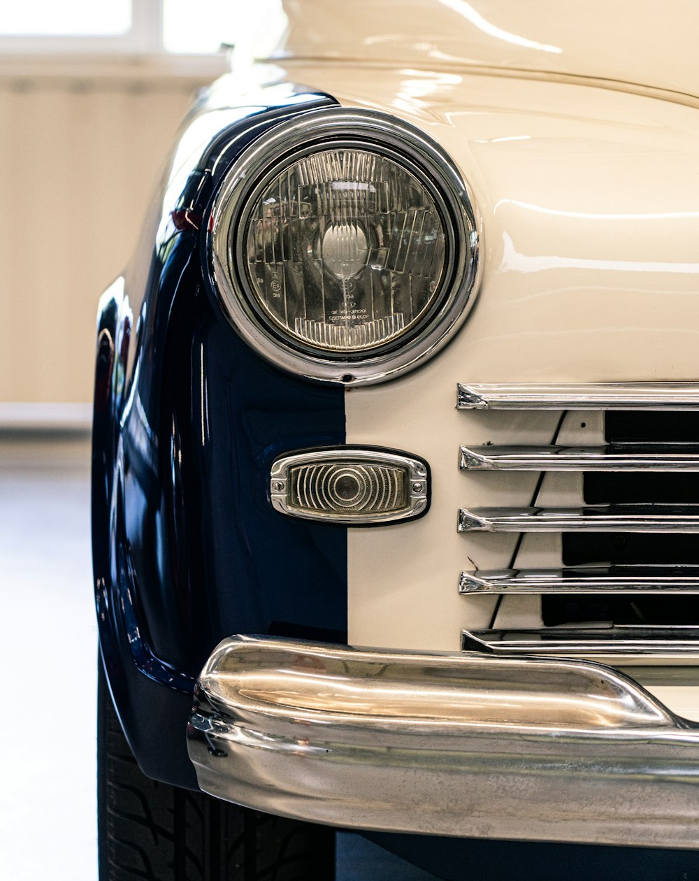 blue and silver car with white background