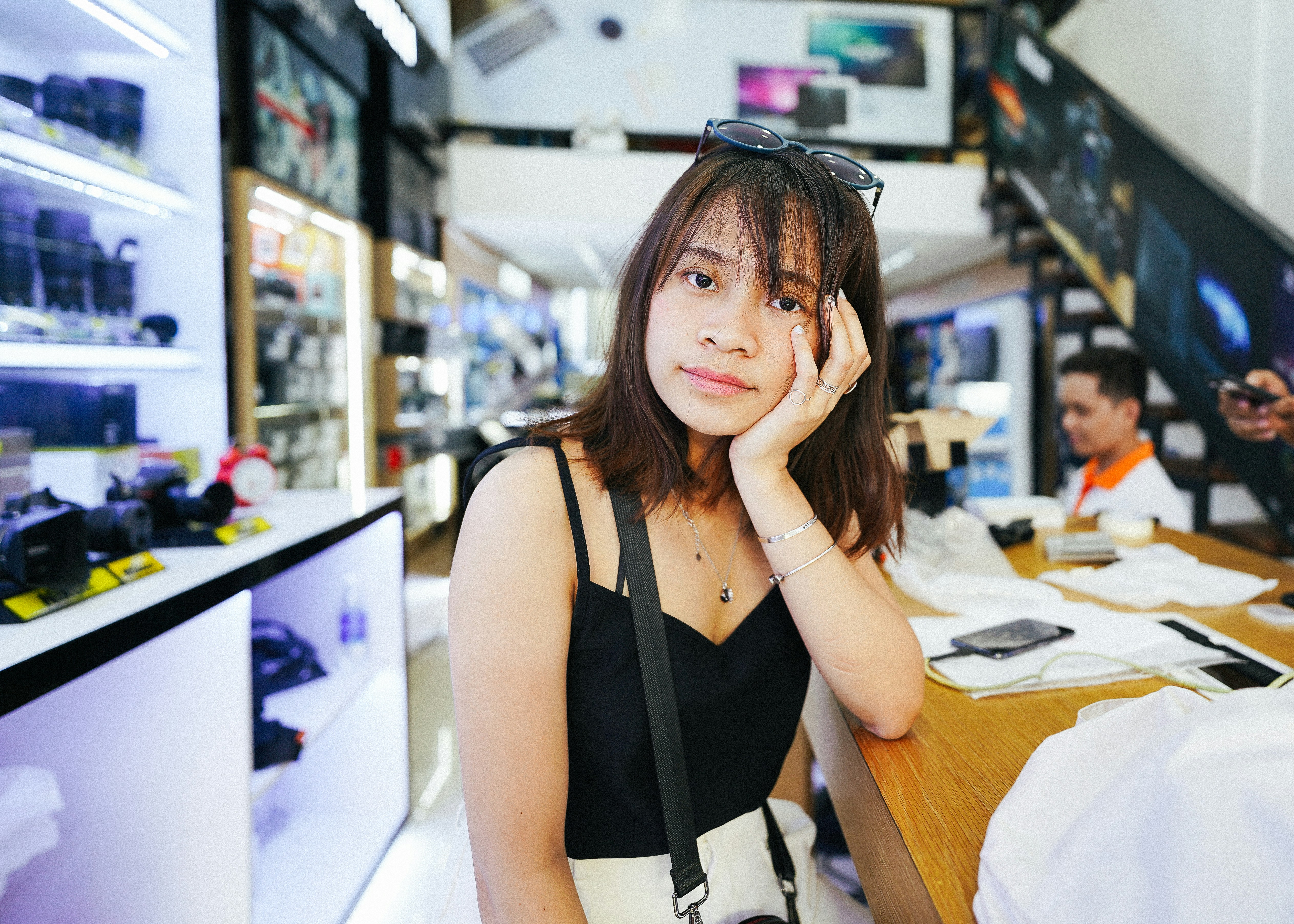 woman in black tank top sitting on chair