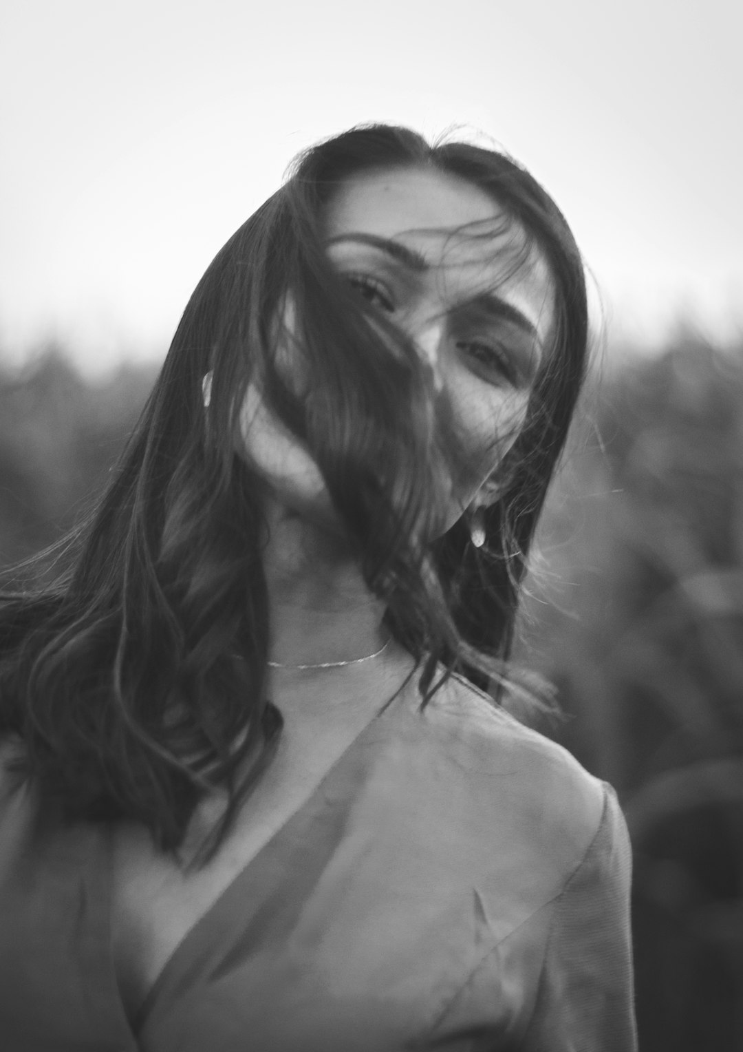 grayscale photo of woman in v neck shirt