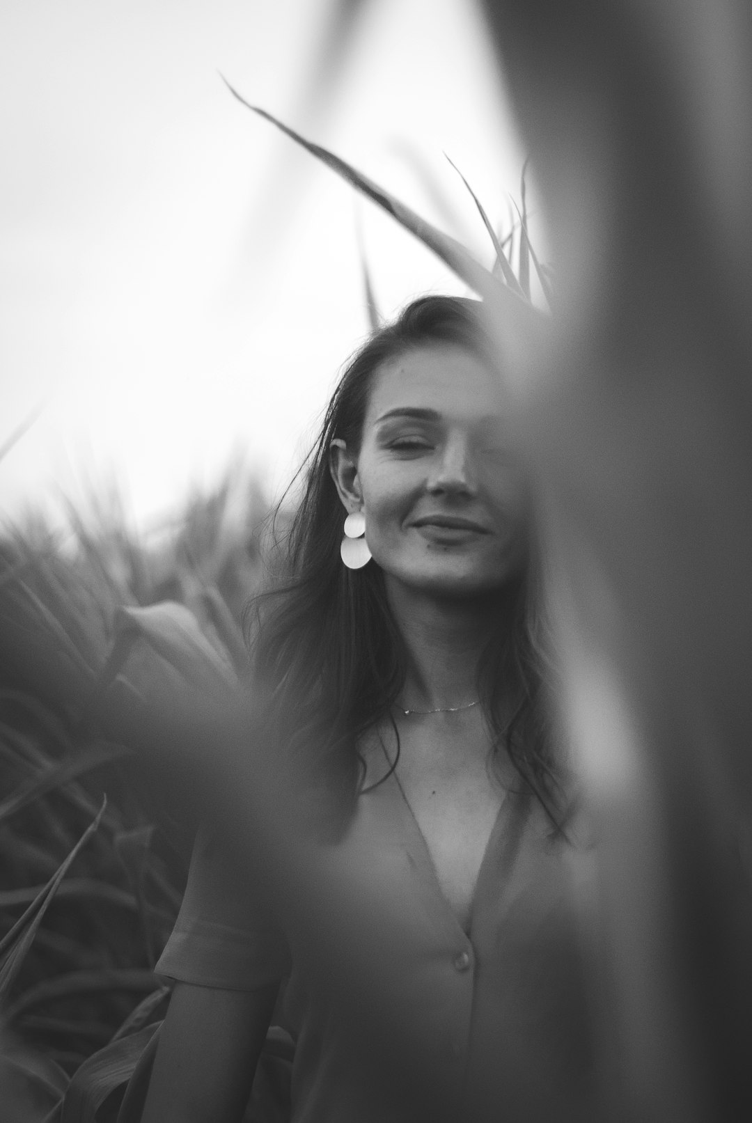 grayscale photo of woman in black tank top