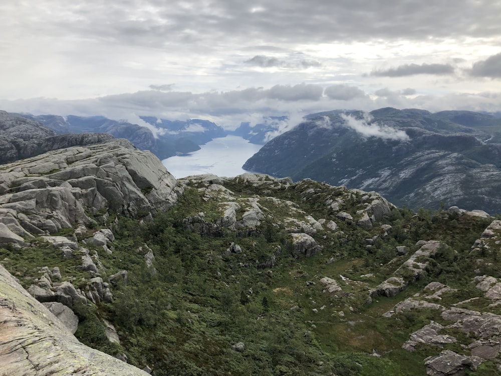 green and brown mountains under white clouds during daytime