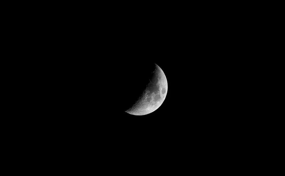 grayscale photo of half moon