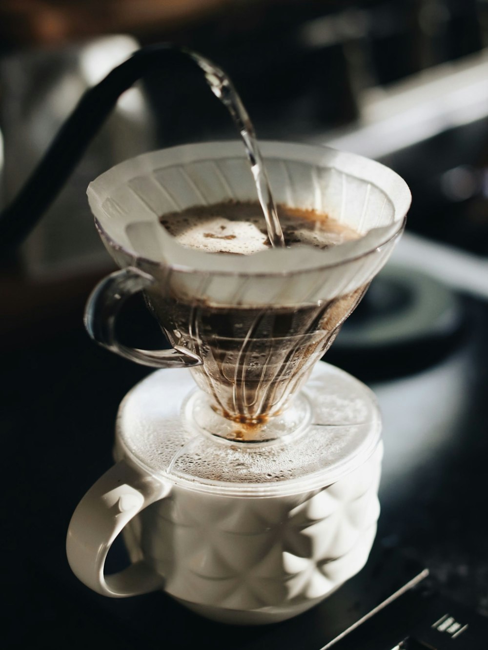 clear glass cup with brown liquid