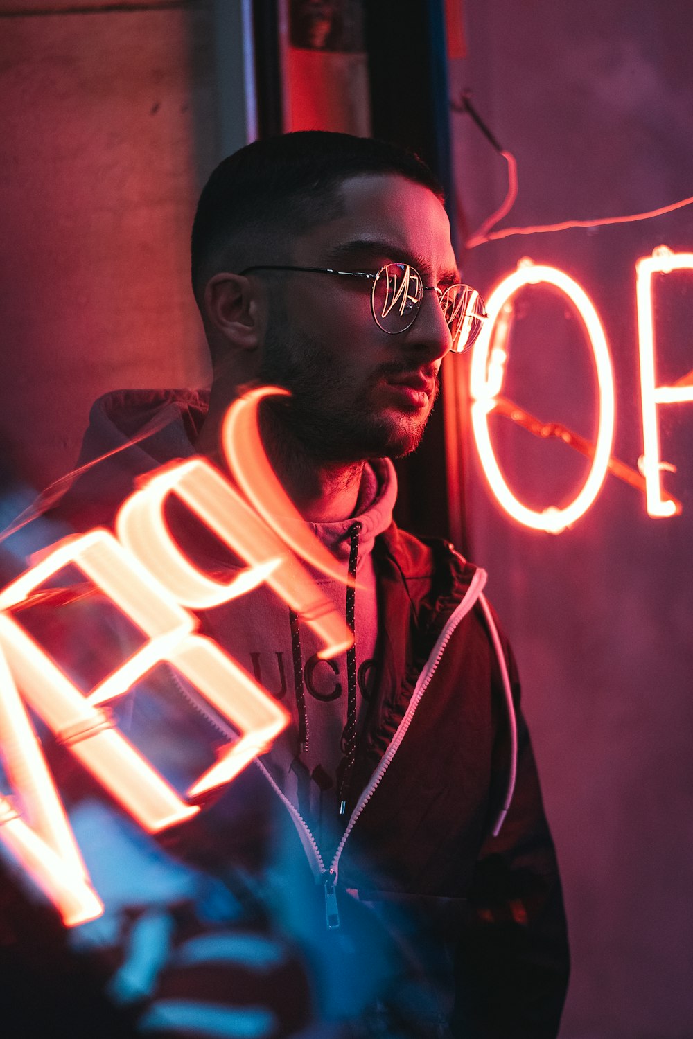 man in black jacket wearing black framed eyeglasses