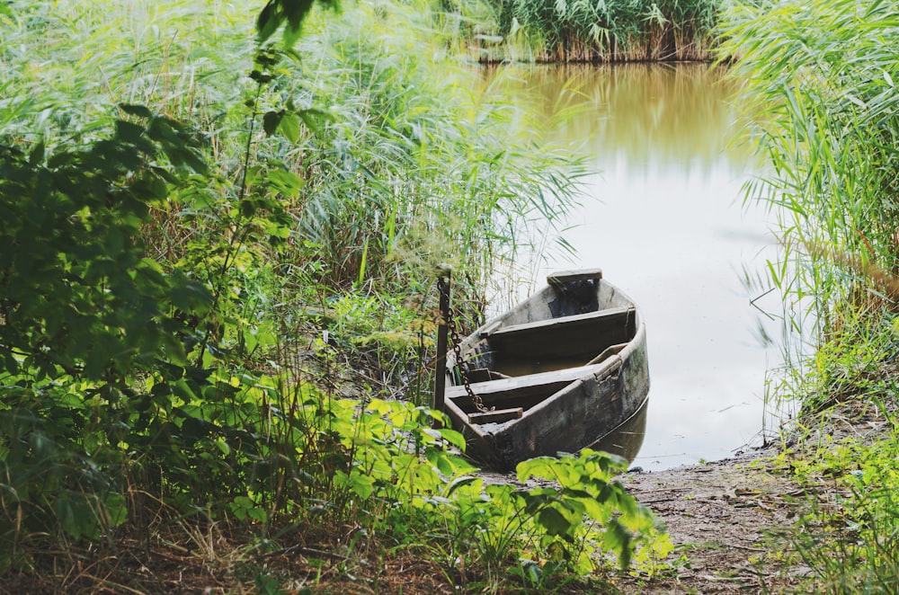 gray boat on river during daytime