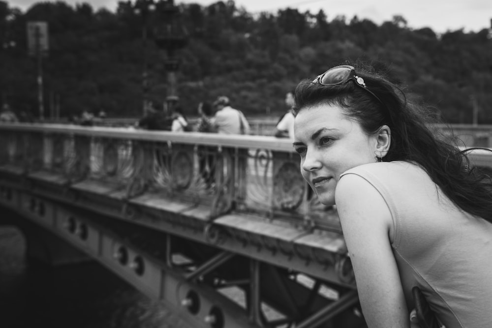 grayscale photo of woman in tank top