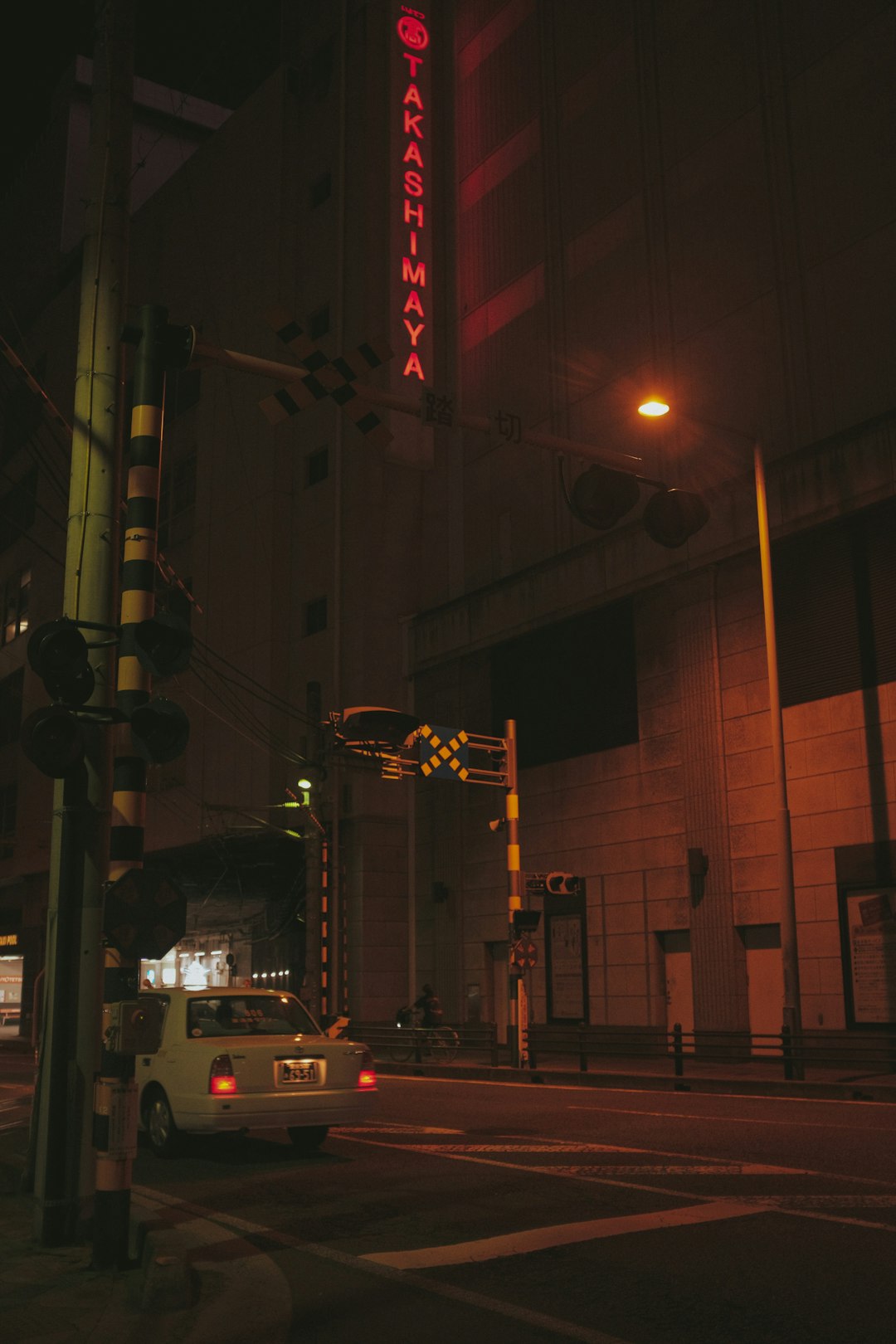 cars on road near building during night time