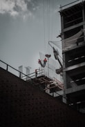 Construction workers building a commercial structure with safety gear
