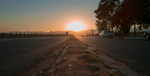 Sunset view over the pilgrims cycling along a winding road in Edo de México.