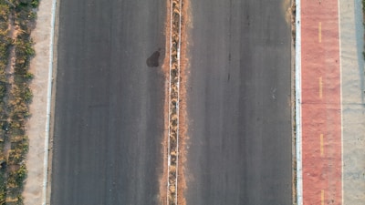 Wide view of a newly completed road with clear lane markings.