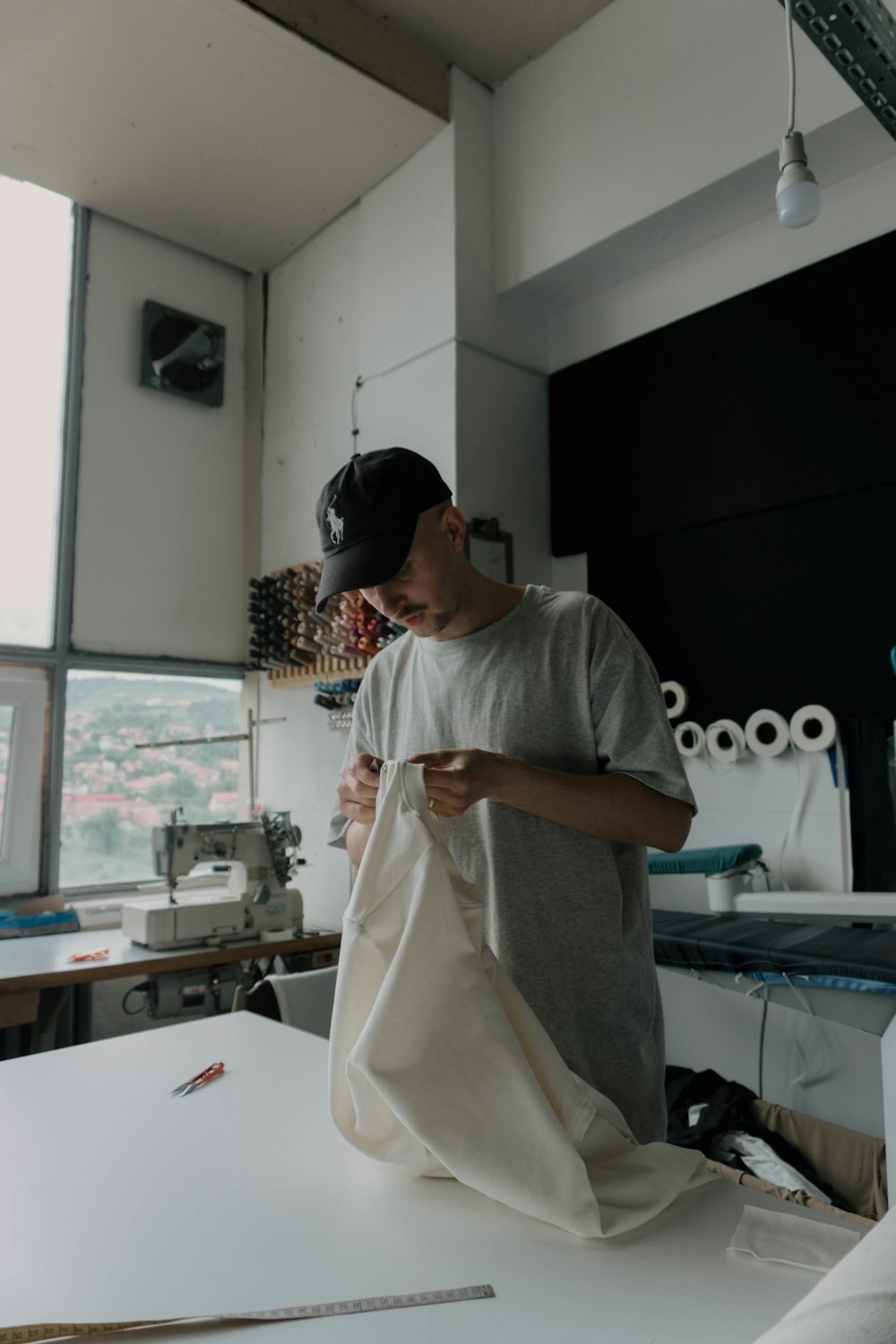 man in white crew neck t-shirt wearing black sunglasses