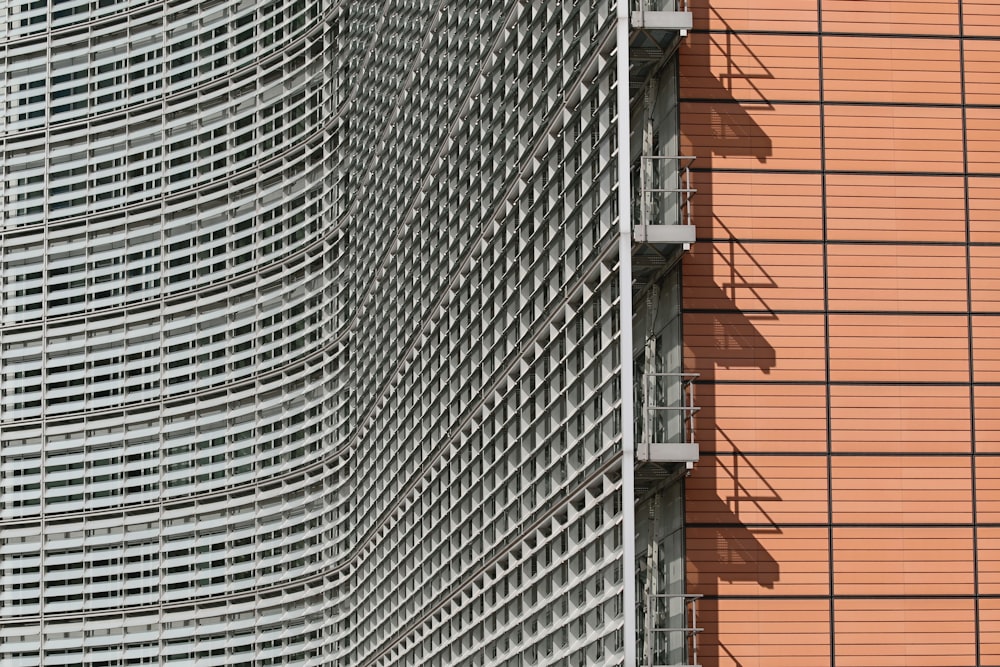 gray metal ladder on brown brick wall