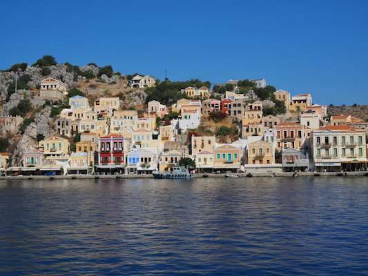 Houses near body of water during daytime — Symi, Greece