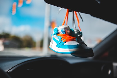 blue white and orange nike running shoes