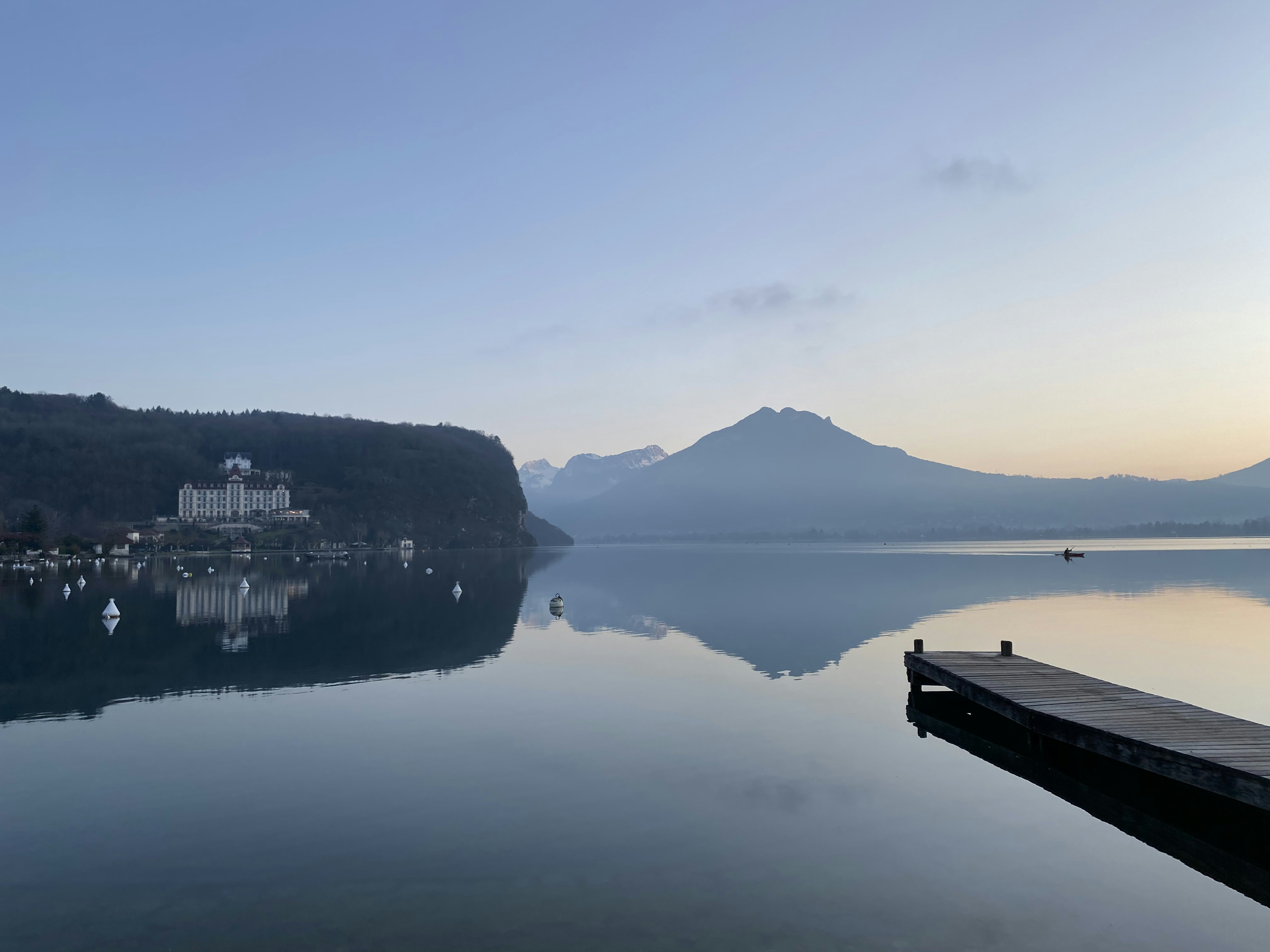 white boat on body of water during daytime