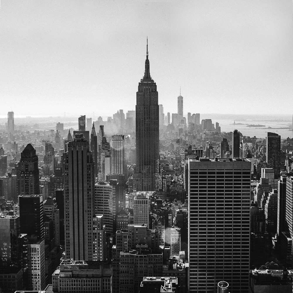 grayscale photo of city buildings