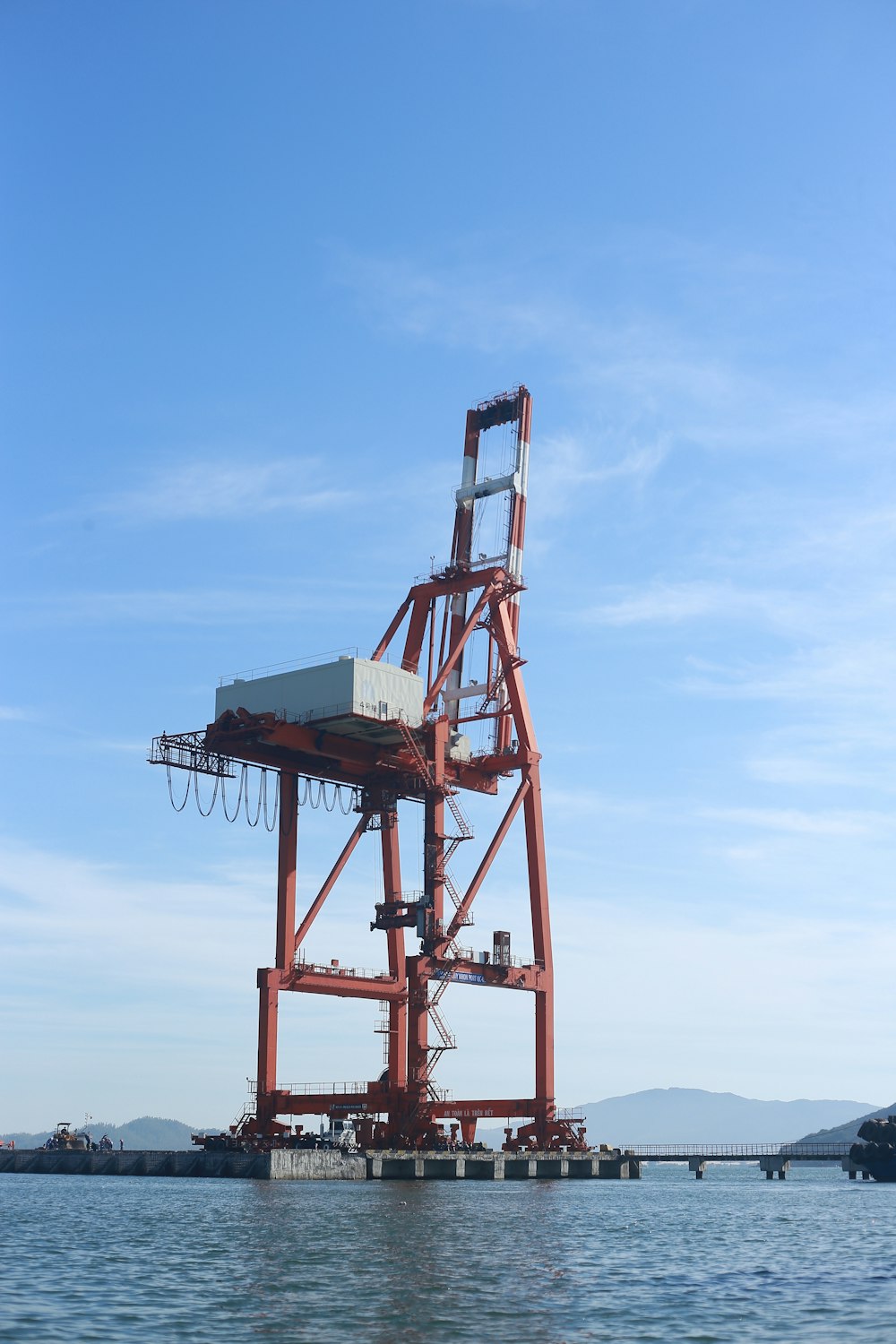 red and blue metal tower under blue sky during daytime