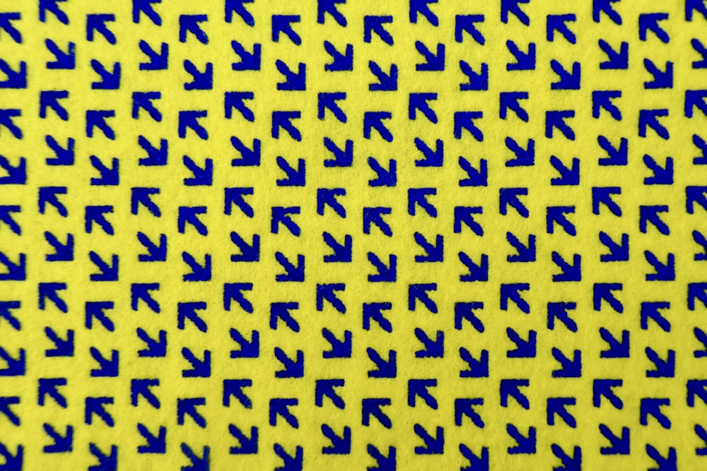 a close up of a blue and yellow pattern