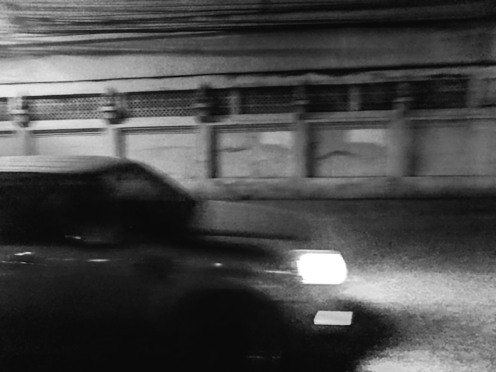 grayscale photo of cars on road