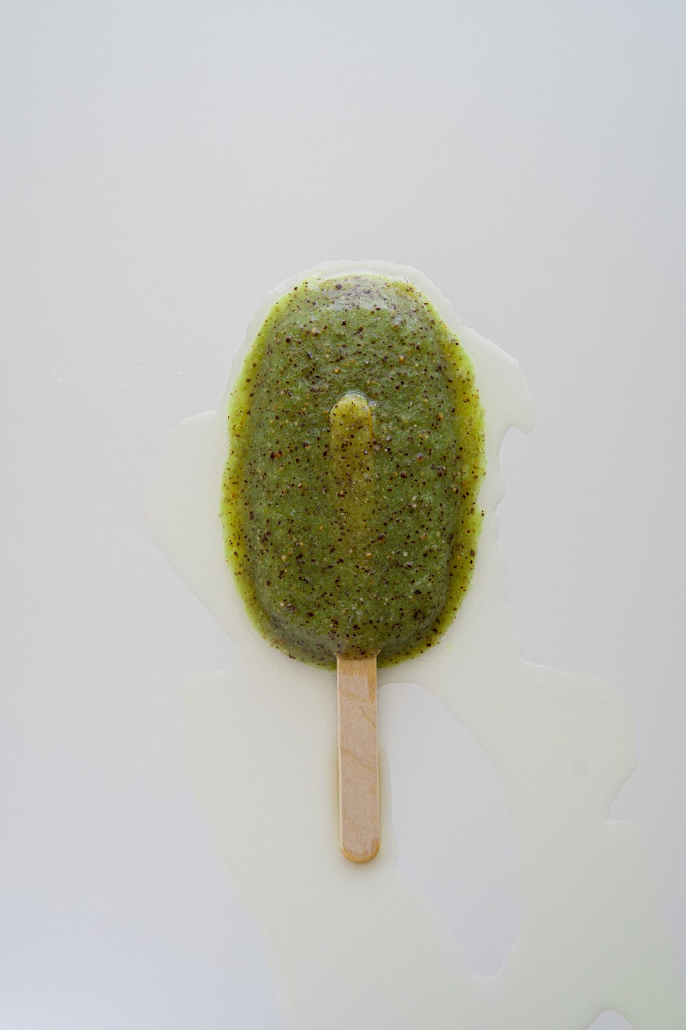 green and brown cake on white ceramic plate