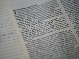 Close-up of a minimalistic printed ledger page with typed text on textured paper.