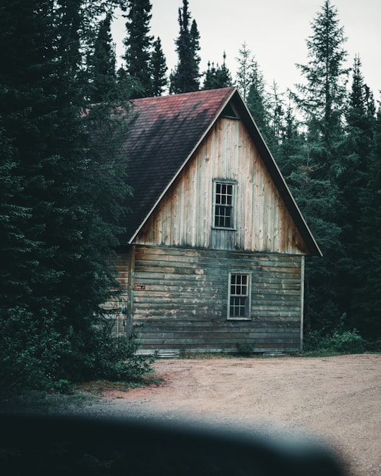 brown wooden house in the middle of forest in Grands-Jardins National Park Canada