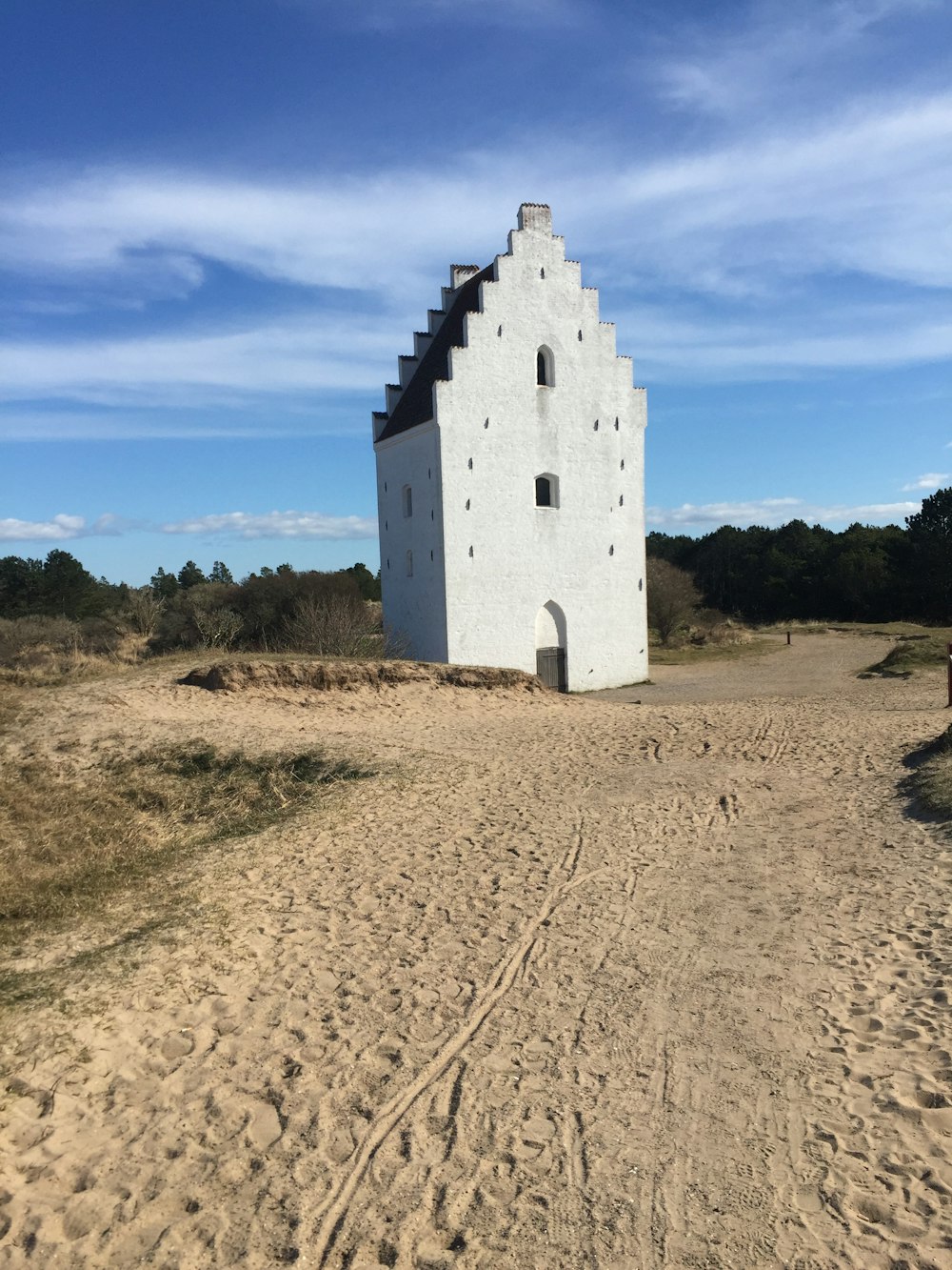 white concrete building under blue sky during daytime