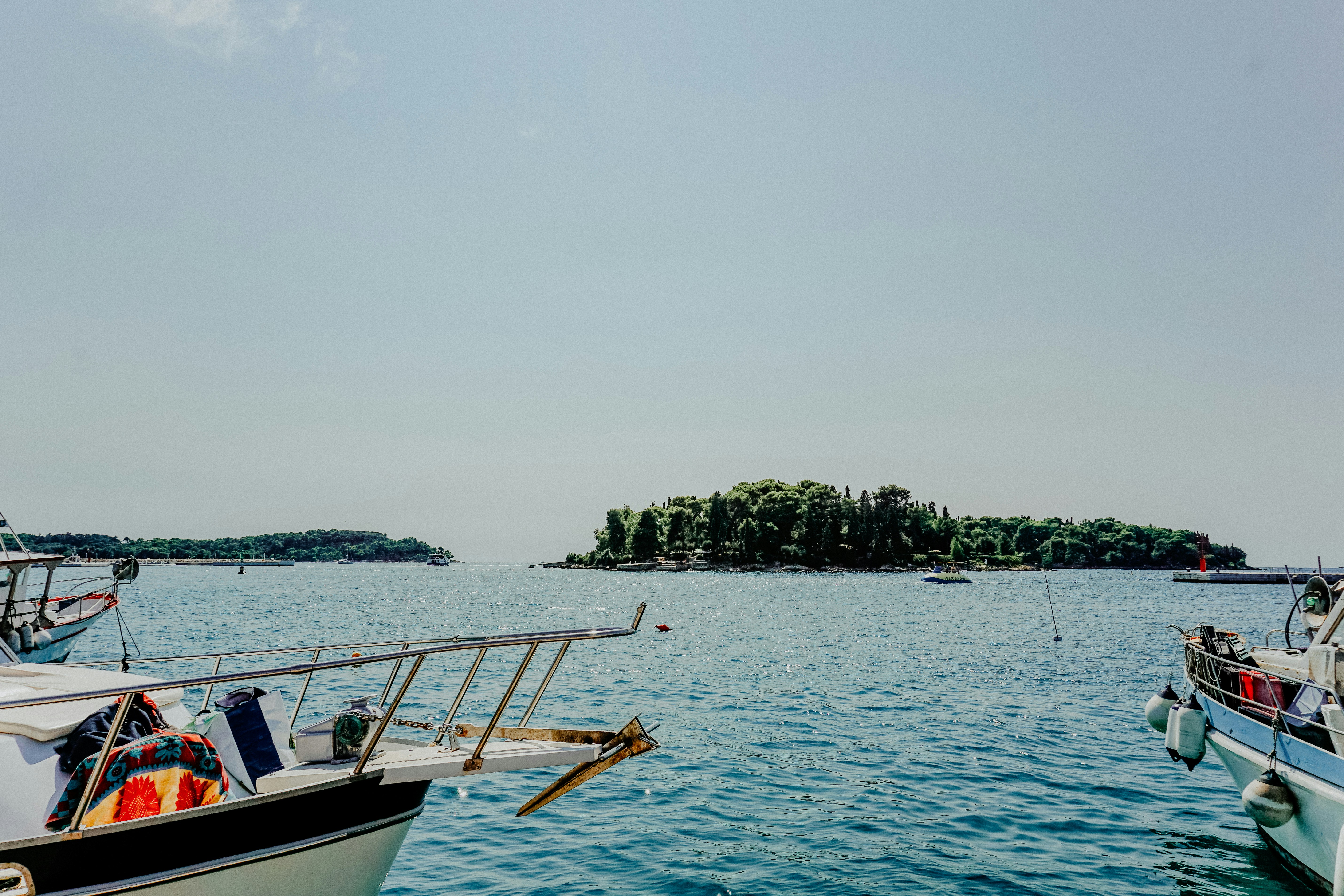 White and brown boat on sea during daytime