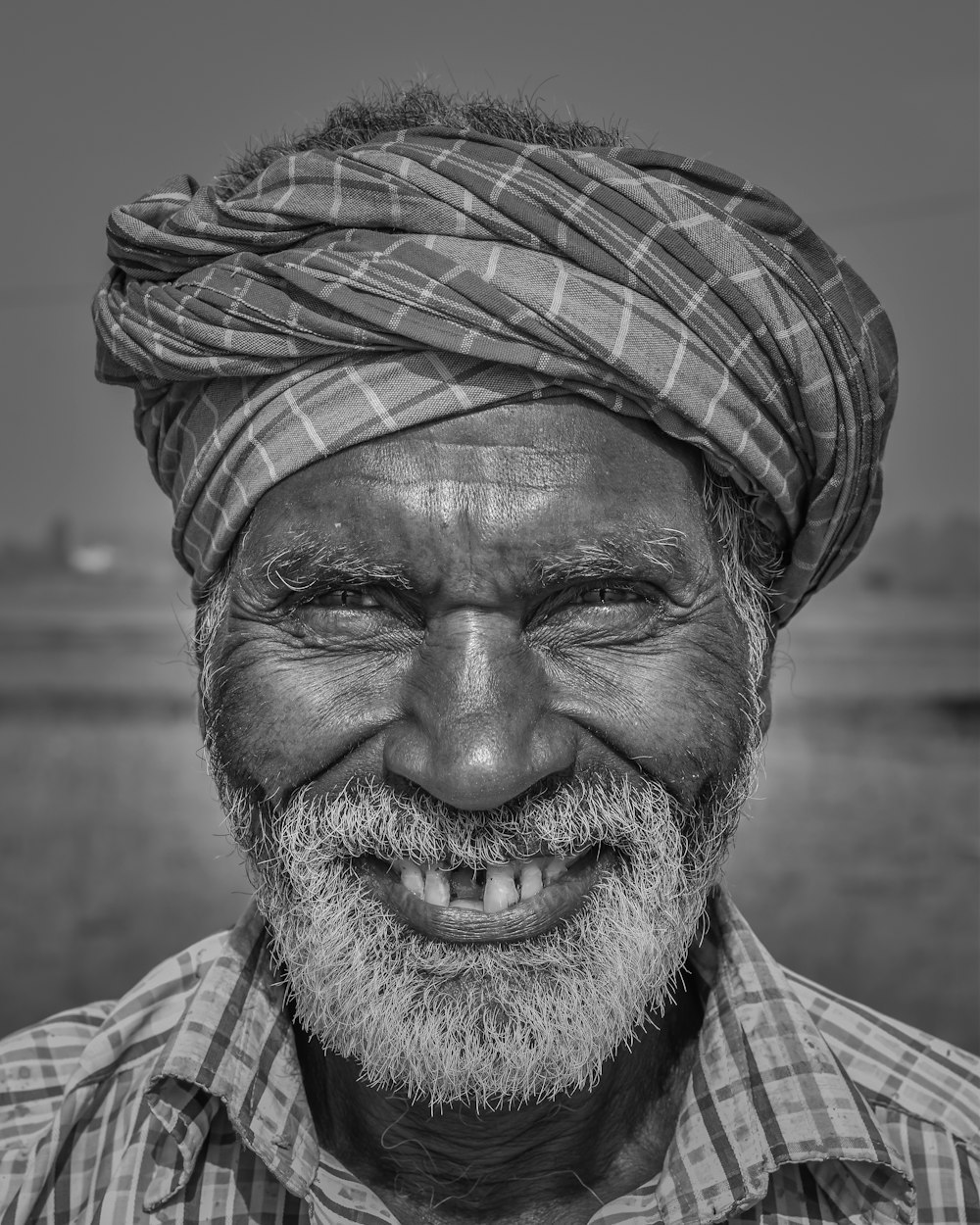 man in white and black plaid shirt