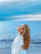 woman in white shirt standing near sea during daytime