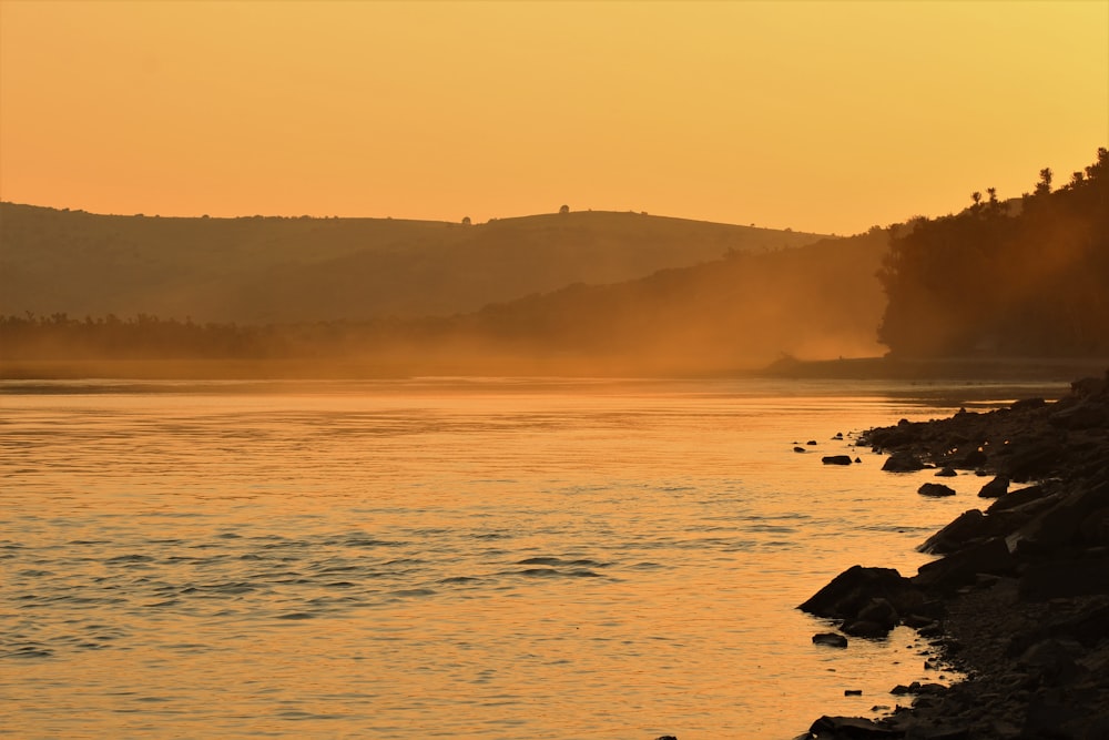 silhouette of mountain during sunset