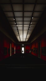 red and black room with lights turned on during nighttime