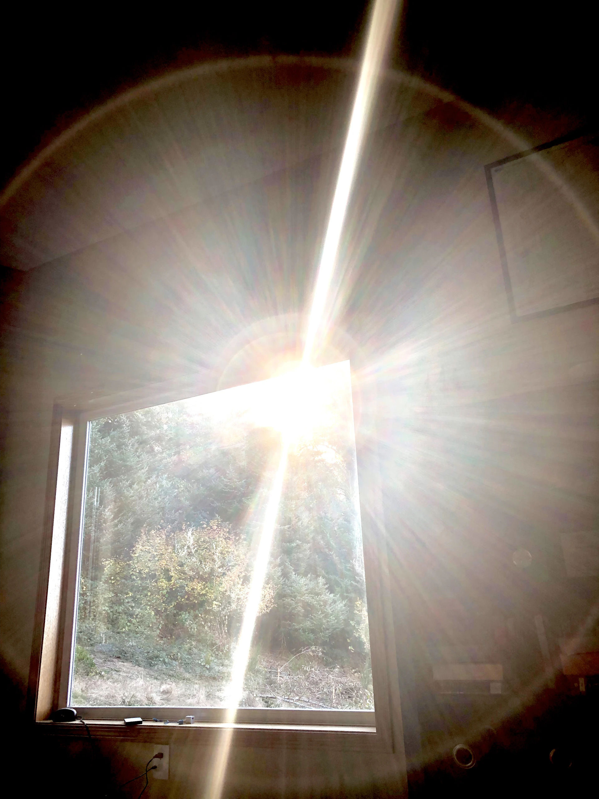 white light bulb turned on during daytime