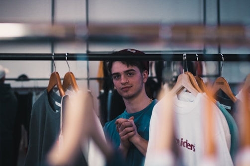 A friendly customer service representative ready to assist with personalized clothing requests.