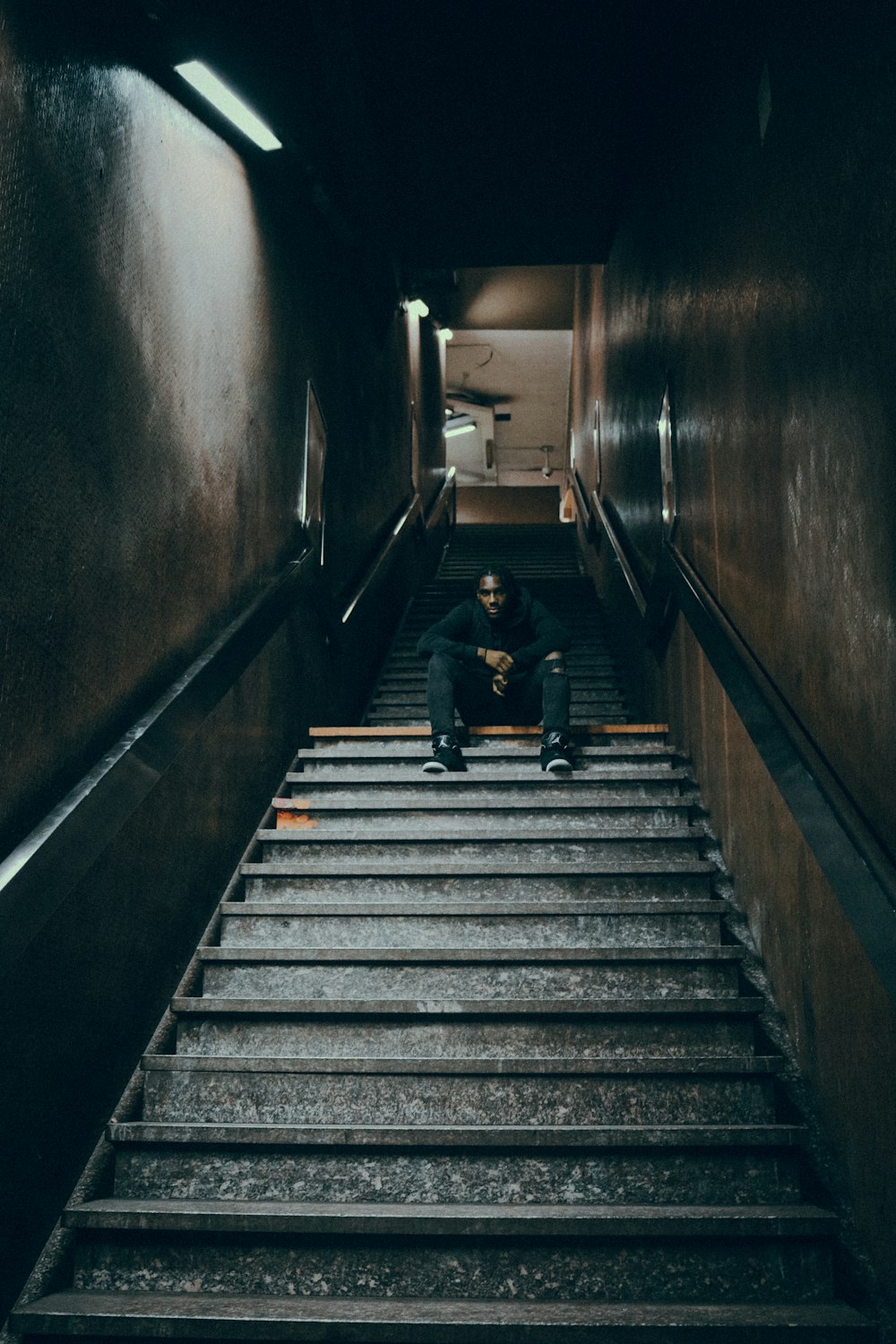 2 person walking on stairs