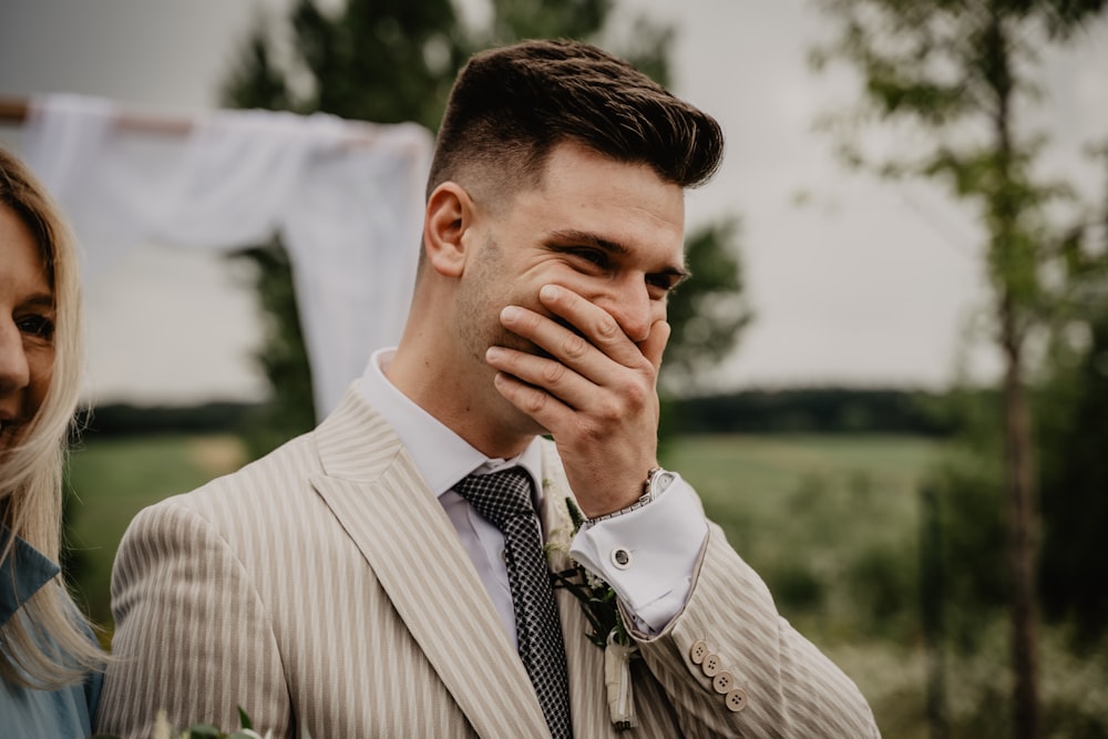 man in white and black pinstripe dress shirt