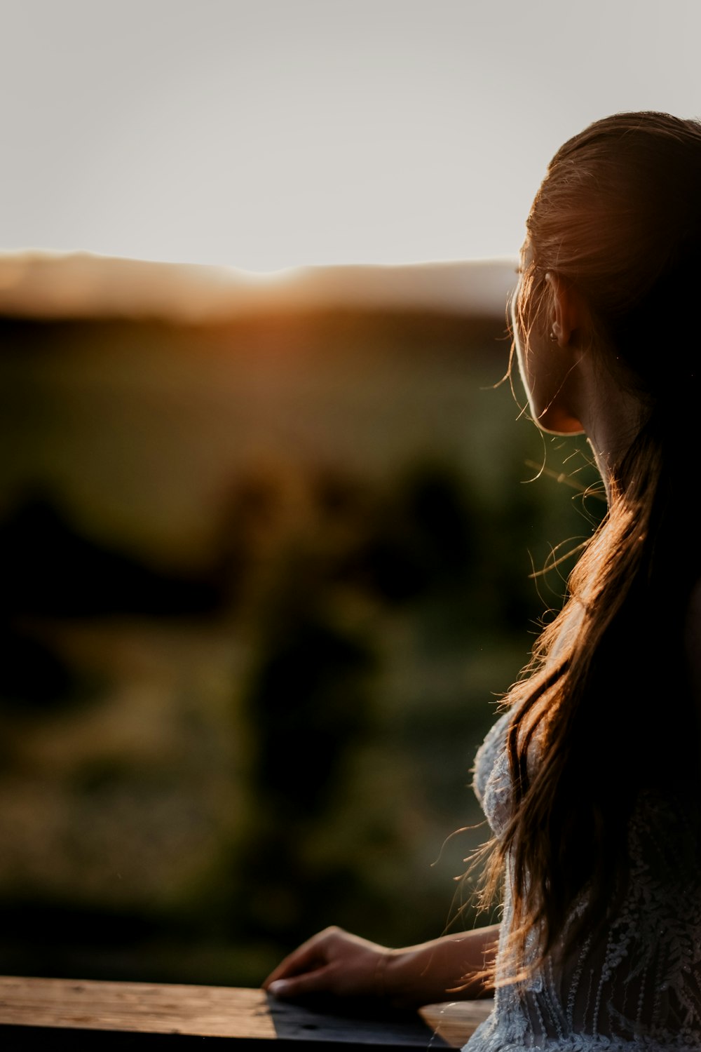 woman in white shirt looking at the sky during daytime