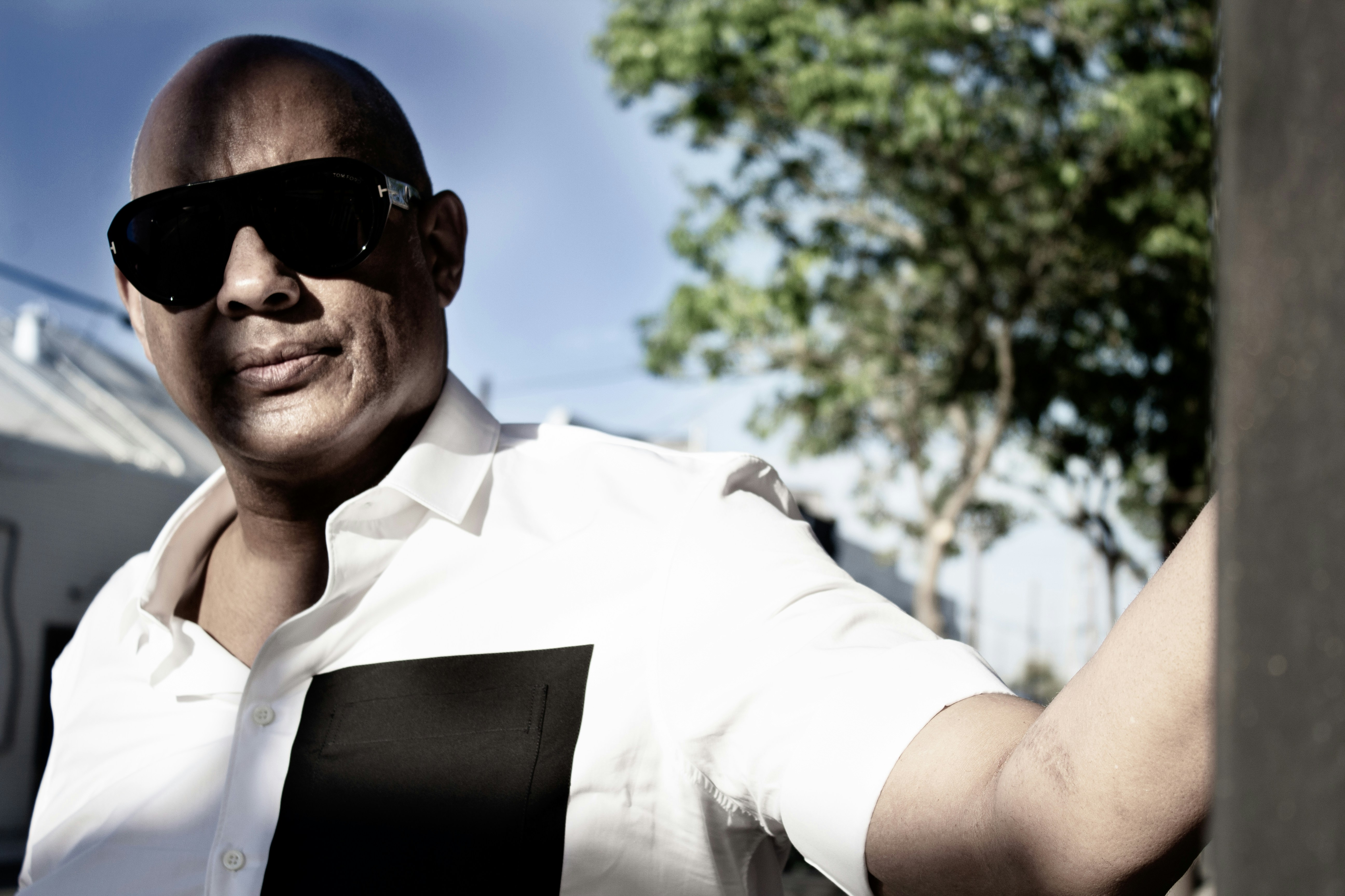 man in white button up shirt wearing black sunglasses