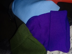 A selection of colorful beanies and gloves perfect for chilly days.