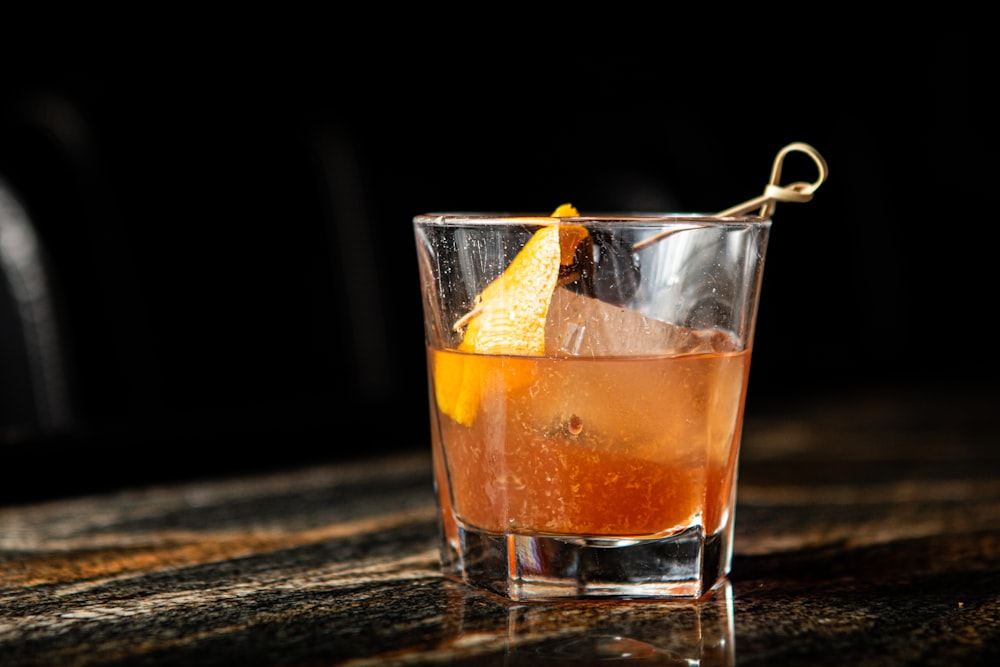 clear drinking glass with orange juice