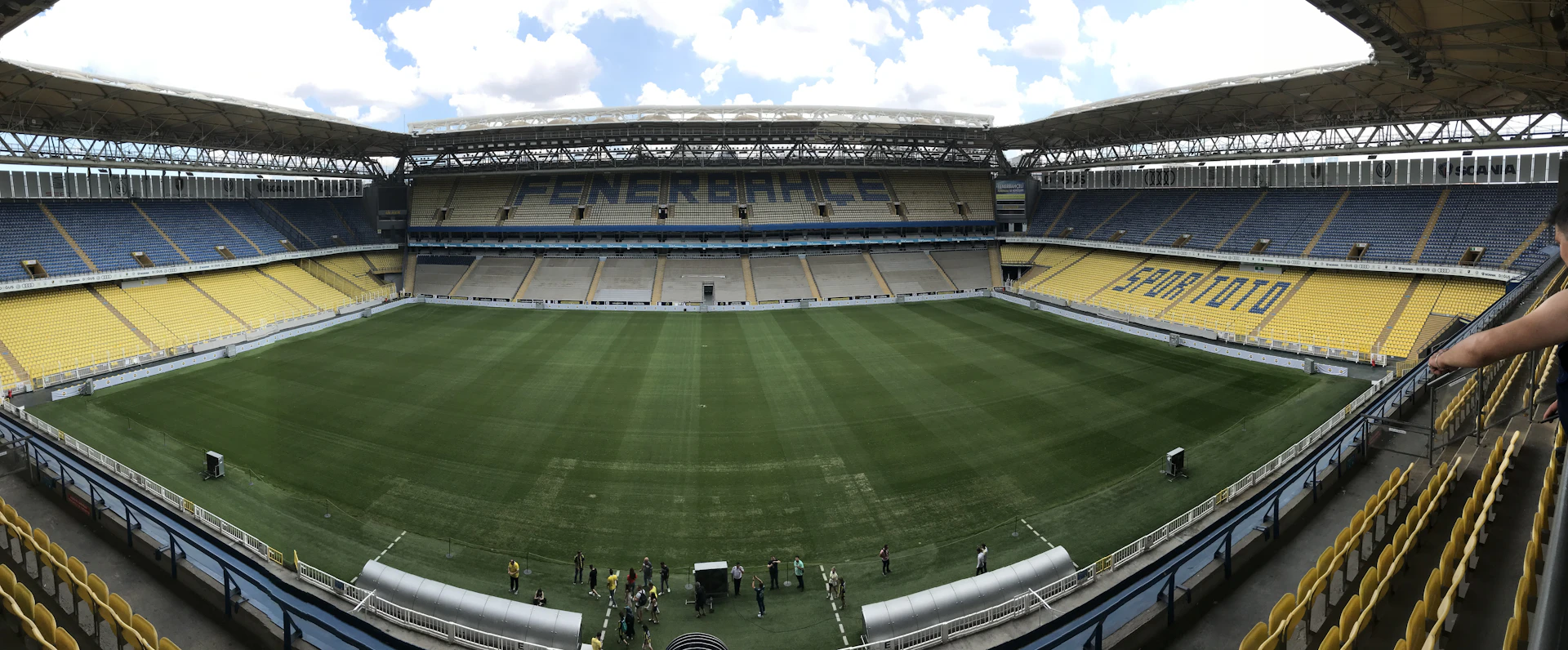 people walking on green field during daytime