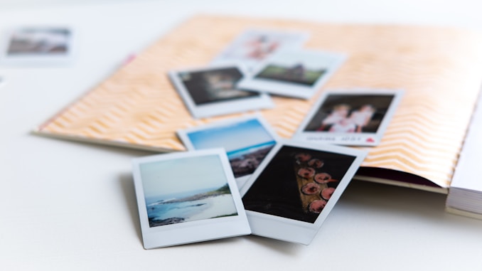 photos on white wooden table