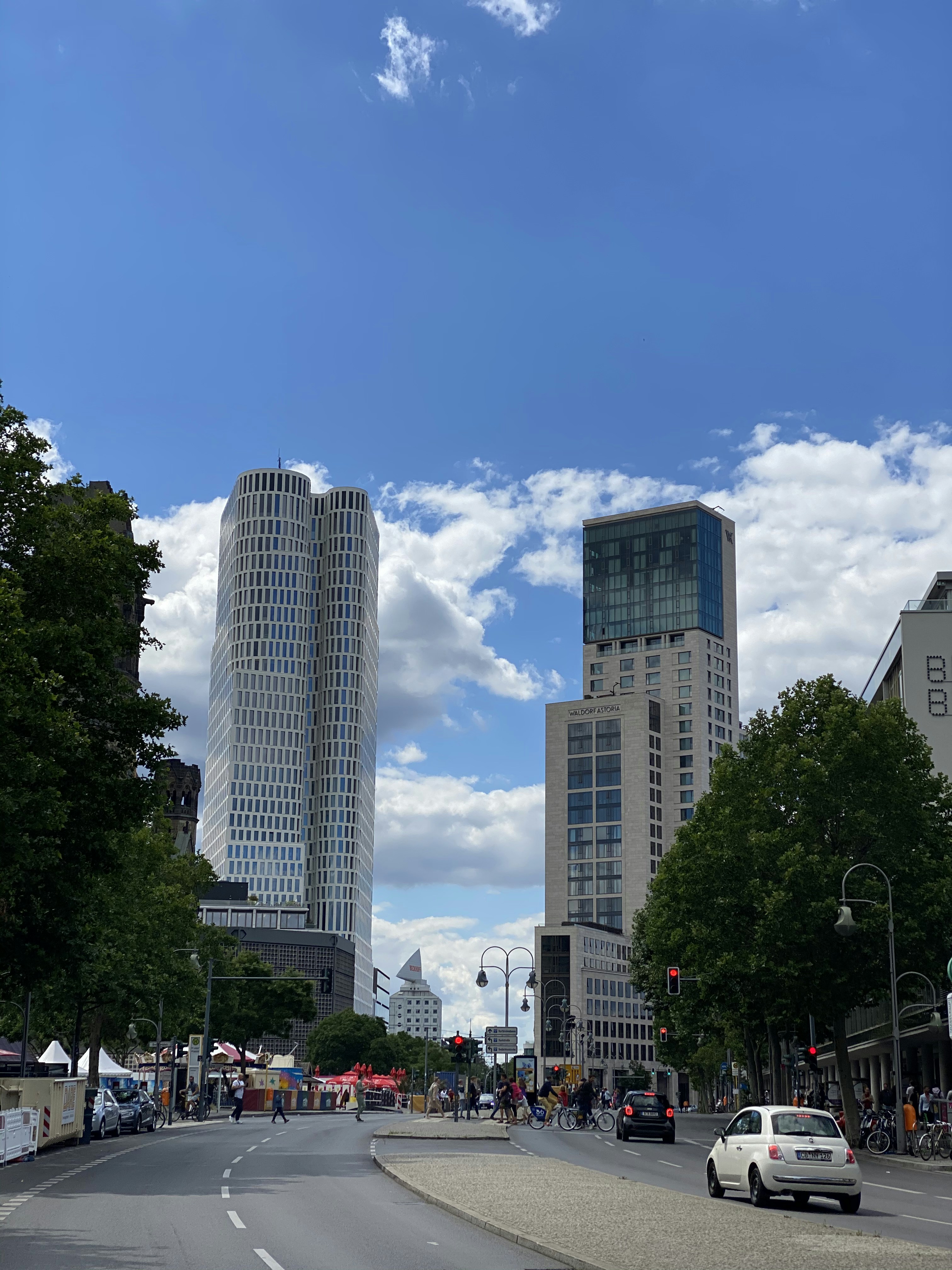 people walking on street near high rise buildings during daytime