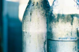 Close-up of chilled Dutchmill milk bottles with condensation.