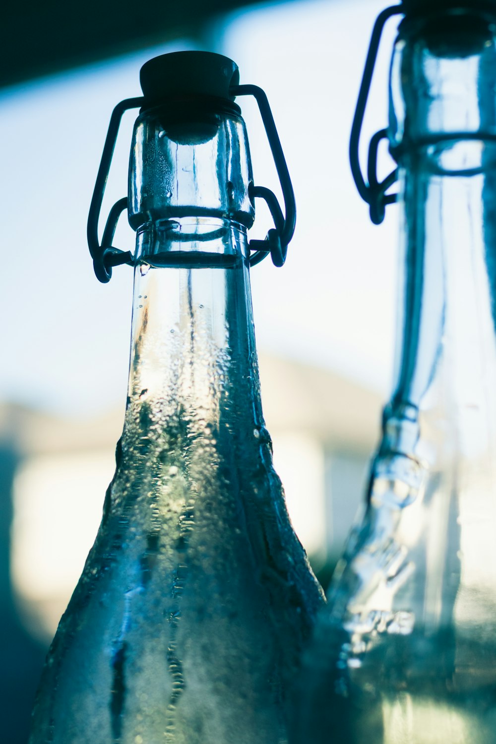 a close up of two empty glass bottles
