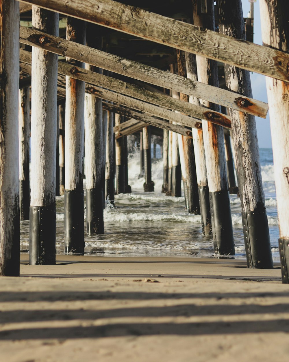 brown wooden dock on sea during daytime