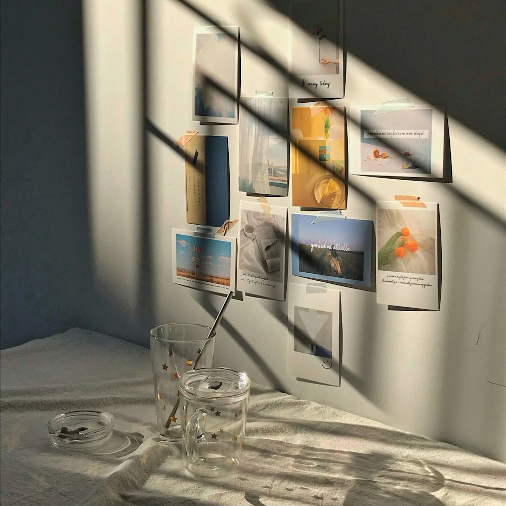 clear glass cup on white wooden shelf