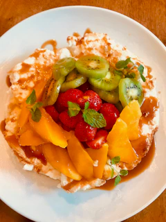 A vibrant plate inspired by Fijian flavors, featuring tropical fruits and spices.