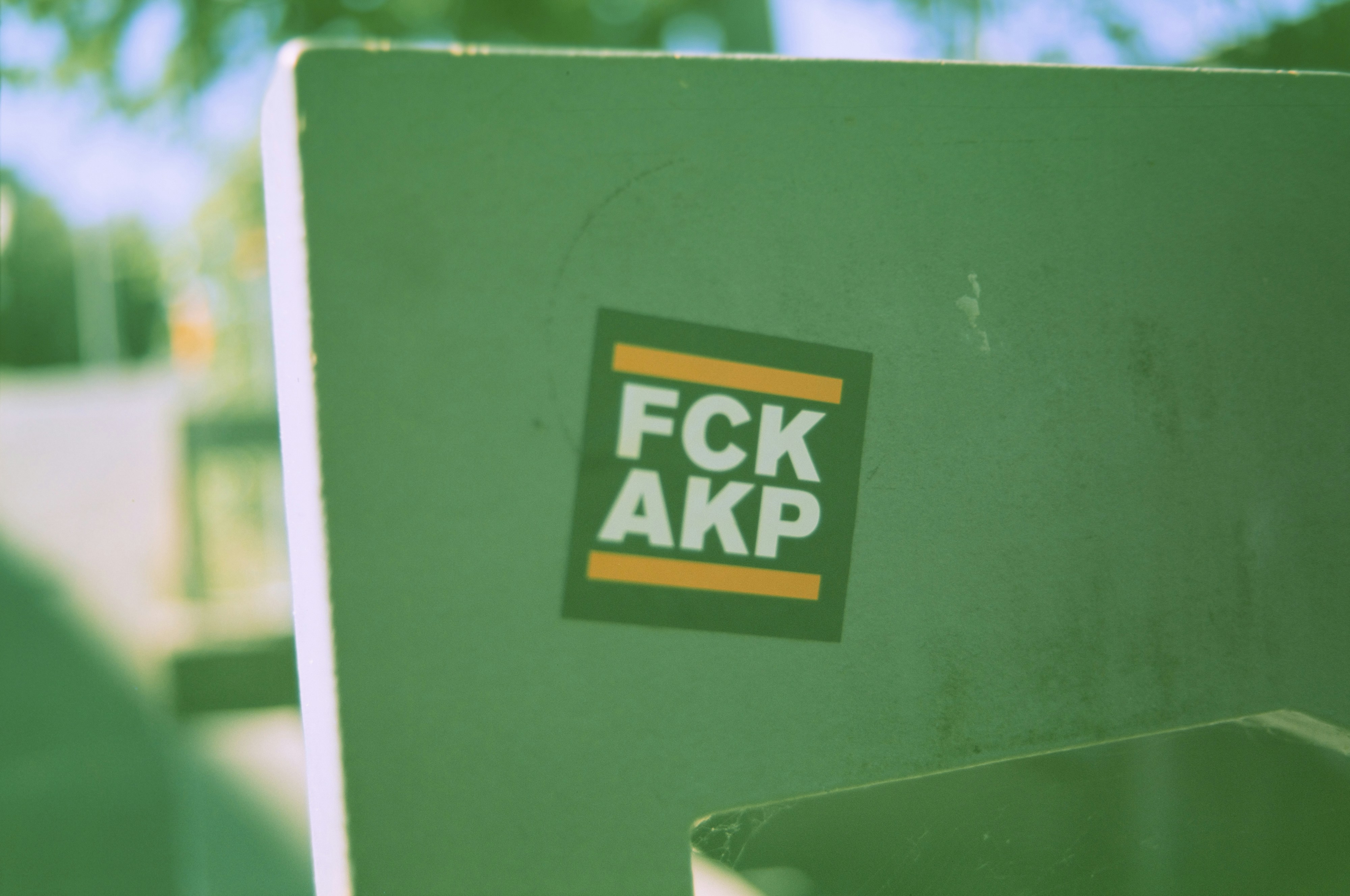 Urban street art sticker: FCK AKP - political protest. Made with Leica R7 (Year: 1994) and Leica Summilux-R 1.4 50mm (Year: 1983). Homemade analog scan. Film reel: Fujicolor Velvia 50 (expired 2005)